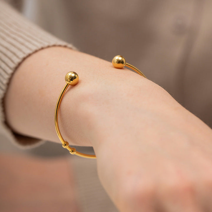 Valantomode | Plated Camille Bangle with Spherical Focal Assets and Monolithic Architecture