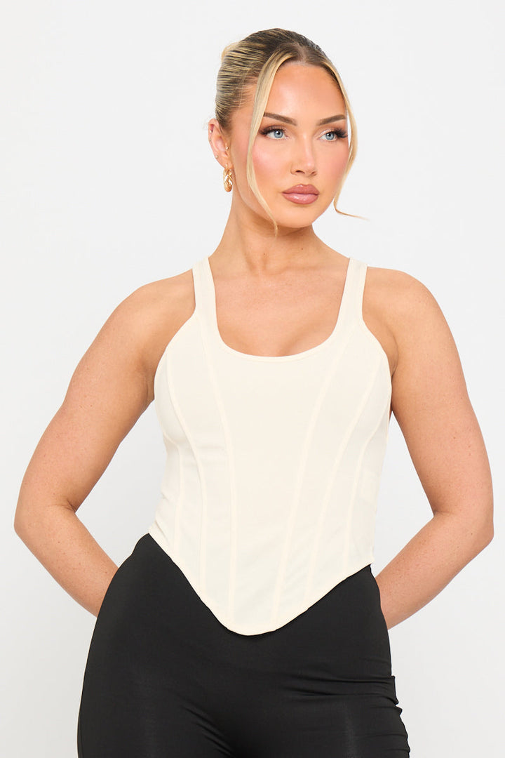 Valantomode | Elegant Cream Corset Top with Dipped Hem Design