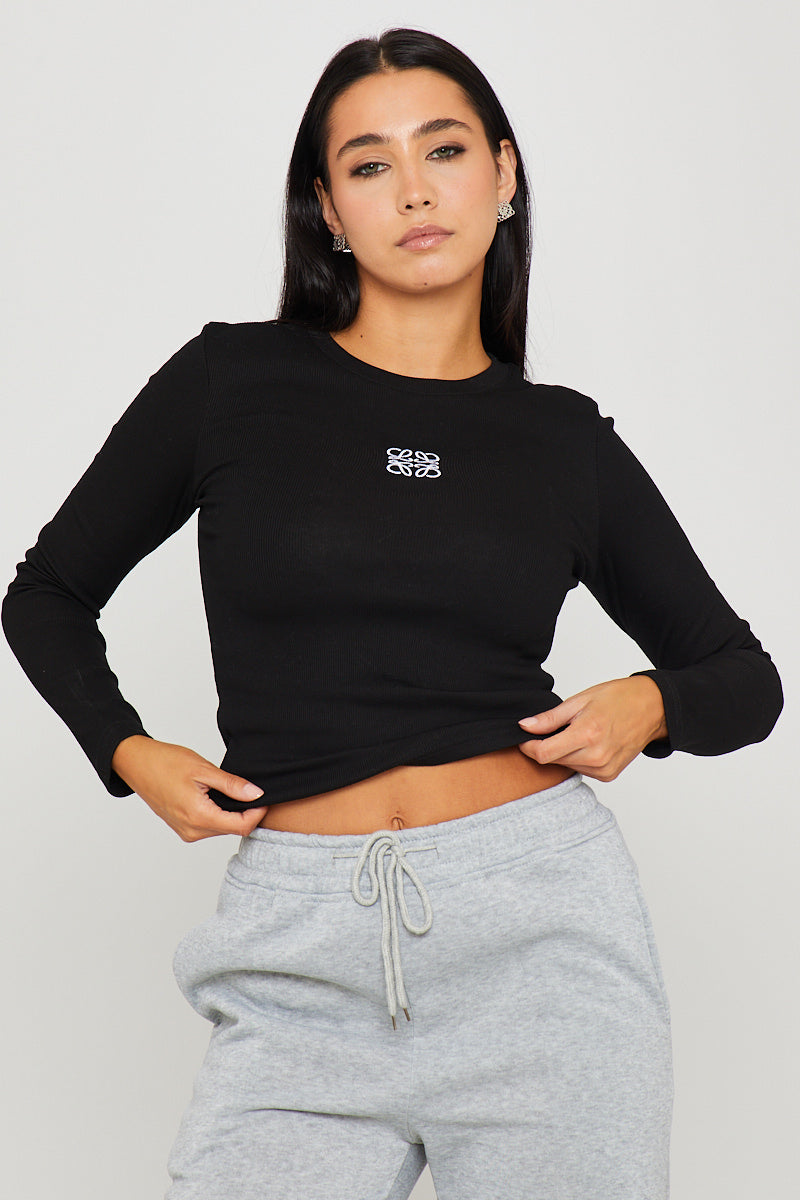 Valantomode | Stylish Black Ribbed Long Sleeve Top with Anagram Embroidery