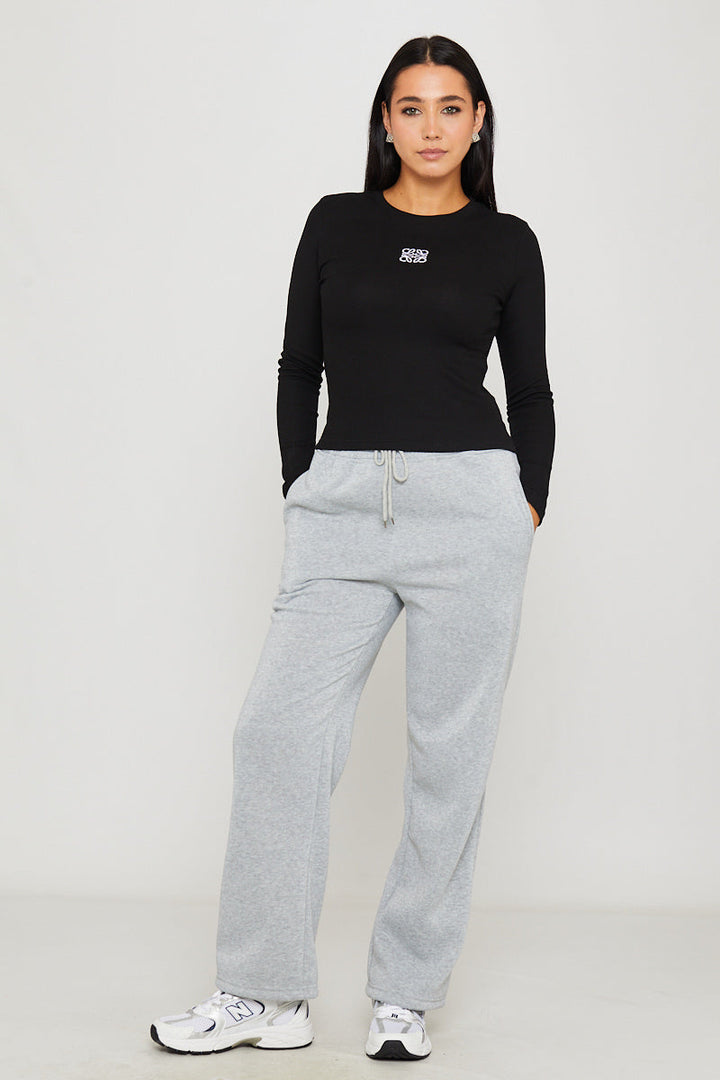 Valantomode | Stylish Black Ribbed Long Sleeve Top with Anagram Embroidery