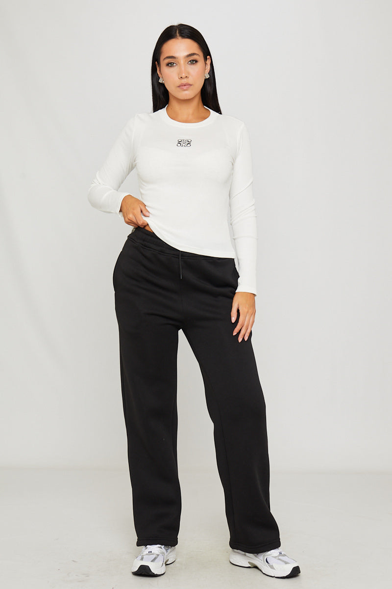 Valantomode | Stylish White Ribbed Long Sleeve Top with Anagram Embroidery