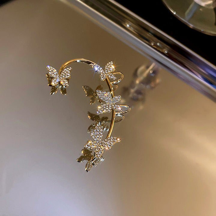 Valantomode | Plated Sculptural Butterfly Earrings with High-Refractive Stone Assets