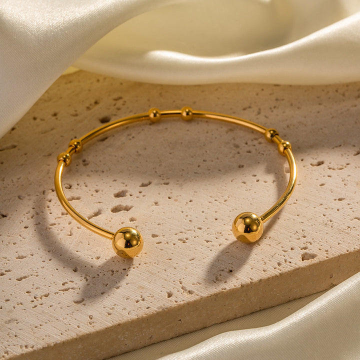 Valantomode | Plated Camille Bangle with Spherical Focal Assets and Monolithic Architecture