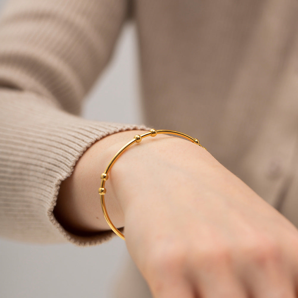 Valantomode | Plated Camille Bangle with Spherical Focal Assets and Monolithic Architecture