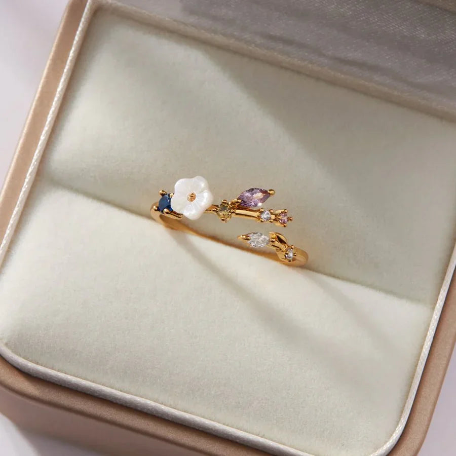 Valantomode | Plated Botanical Motif Ring with Chromatic Refractive Assets and Floral Inlay