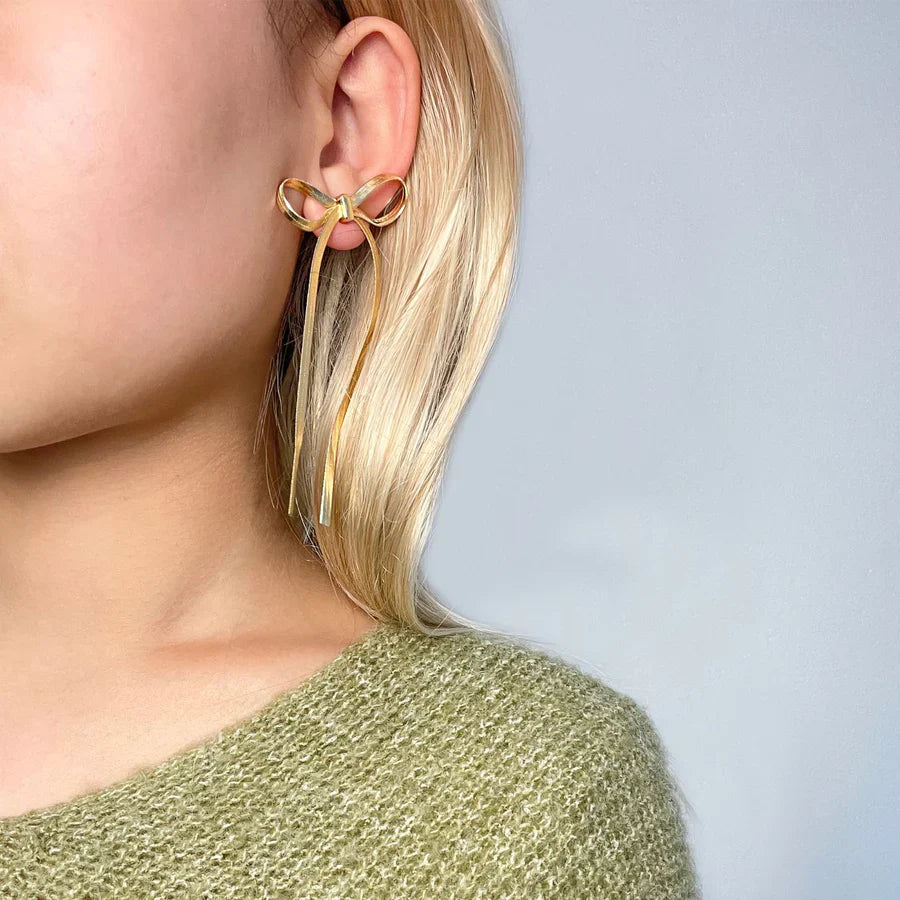 Valantomode | Plated Bow Earrings with Asymmetric Loop Architecture and Linear Geometry