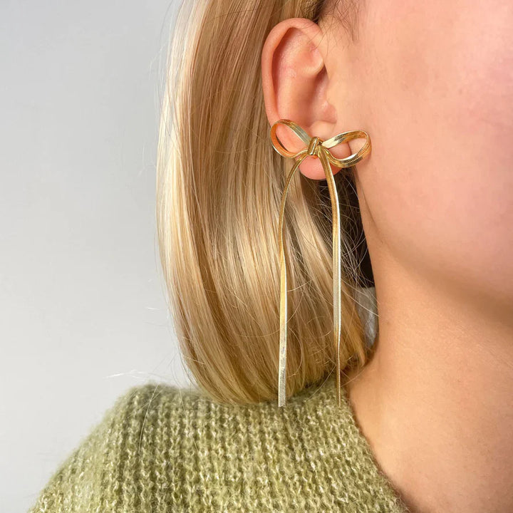 Valantomode | Plated Bow Earrings with Asymmetric Loop Architecture and Linear Geometry
