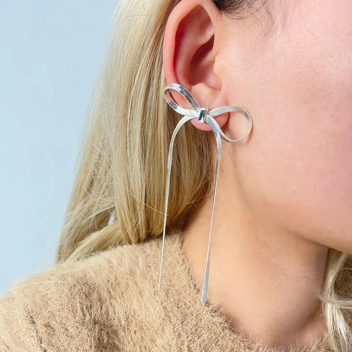 Valantomode | Plated Bow Earrings with Asymmetric Loop Architecture and Linear Geometry