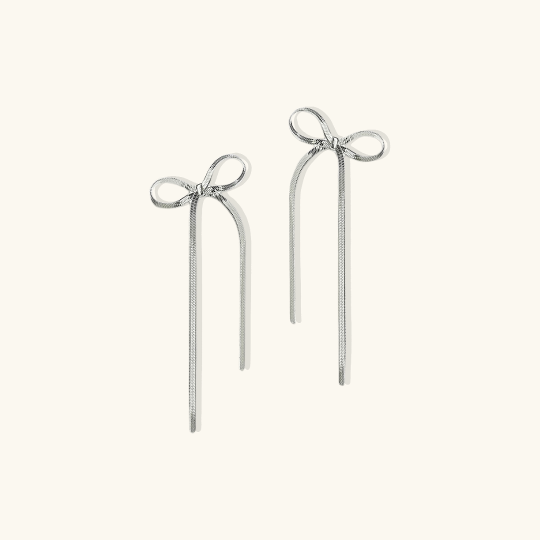 Valantomode | Plated Bow Earrings with Asymmetric Loop Architecture and Linear Geometry