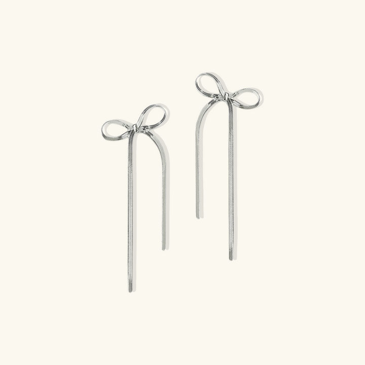 Valantomode | Plated Bow Earrings with Asymmetric Loop Architecture and Linear Geometry