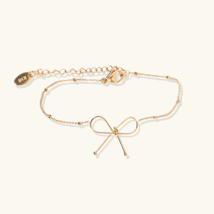Valantomode | Plated Symmetrical Bow Bracelet with Linear Ribbon Structuralism