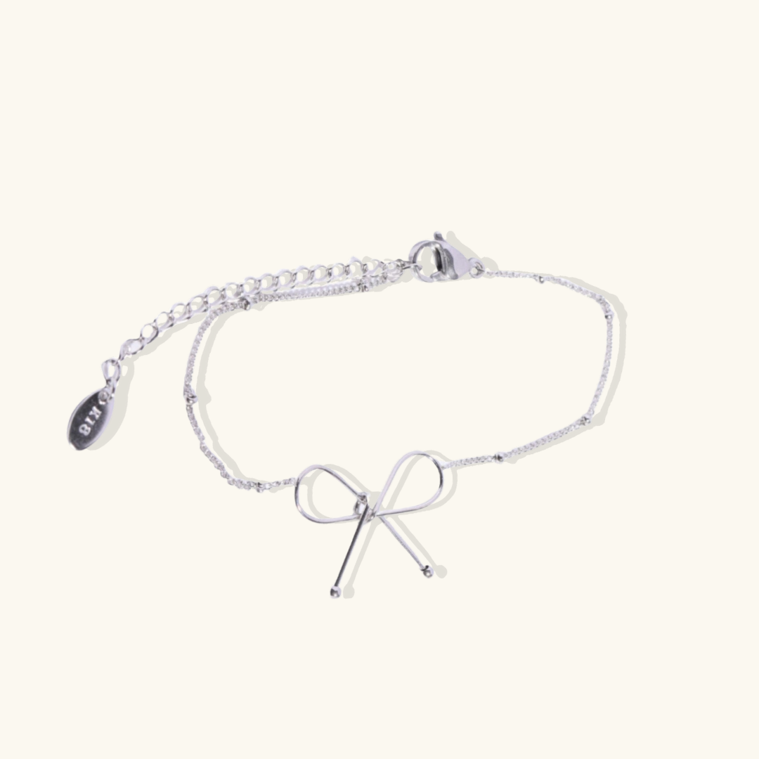 Valantomode | Plated Symmetrical Bow Bracelet with Linear Ribbon Structuralism