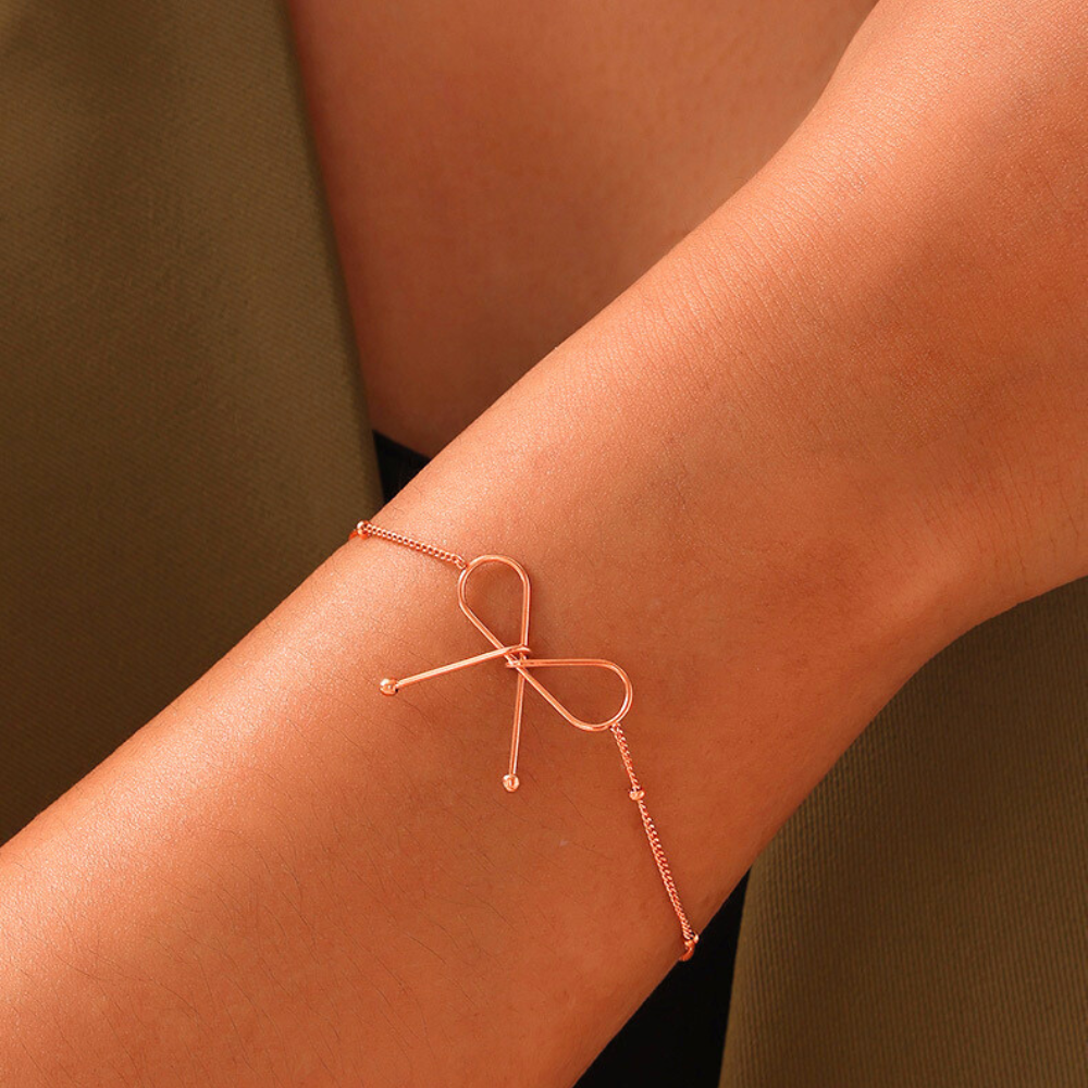 Valantomode | Plated Symmetrical Bow Bracelet with Linear Ribbon Structuralism