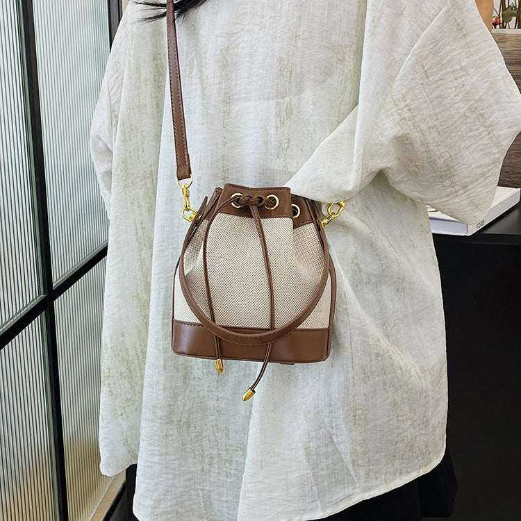 Valantomode | Odyssey Cyclus Courier – Premium Canvas & Vegan Leather Hybrid Mini Bucket Bag