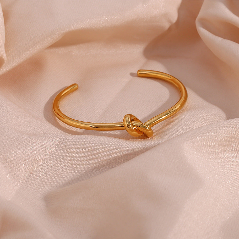 Valantomode | Plated Open-Ended Knot Bangle with Polished Monolithic Architecture