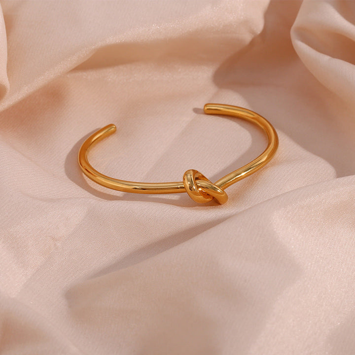 Valantomode | Plated Open-Ended Knot Bangle with Polished Monolithic Architecture