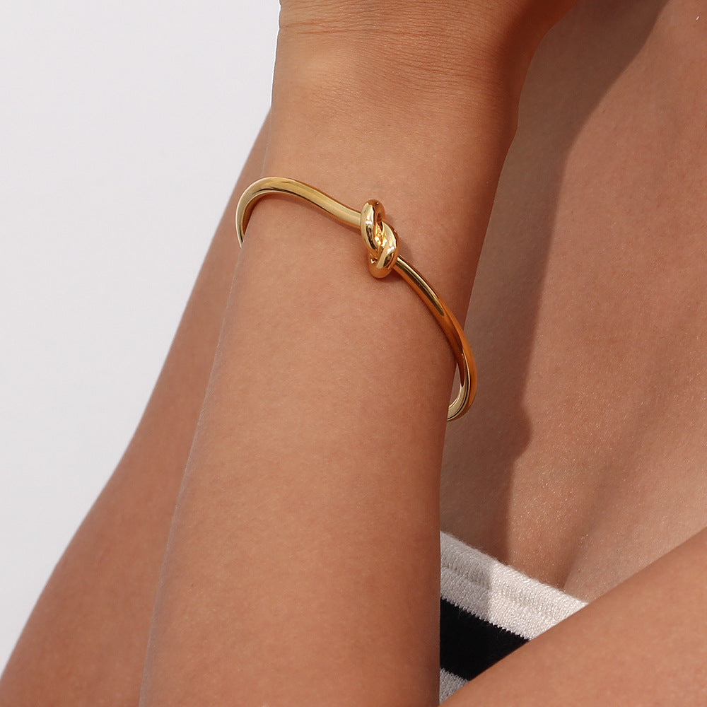 Valantomode | Plated Open-Ended Knot Bangle with Polished Monolithic Architecture