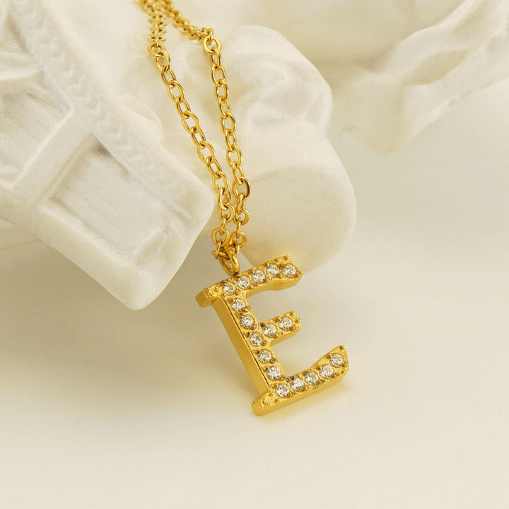 Valantomode | Plated Stainless Steel Typographic Necklace with Refractive Stone Asset