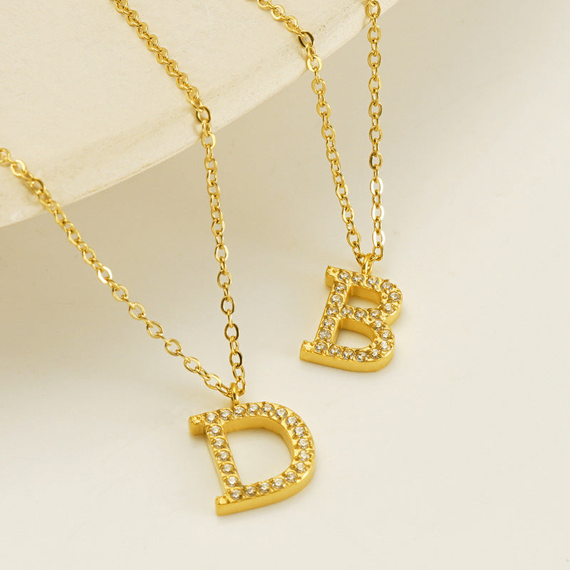 Valantomode | Plated Stainless Steel Typographic Necklace with Refractive Stone Asset