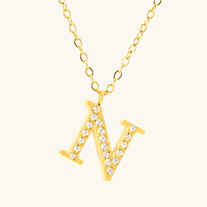 Valantomode | Plated Stainless Steel Typographic Necklace with Refractive Stone Asset