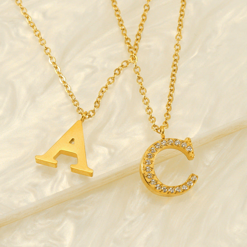Valantomode | Plated Stainless Steel Typographic Necklace with Refractive Stone Asset