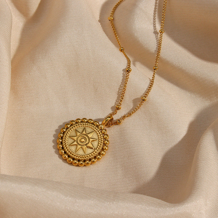 Valantomode | Plated Sunburst Pendant Necklace with Radial Solar Structuralism