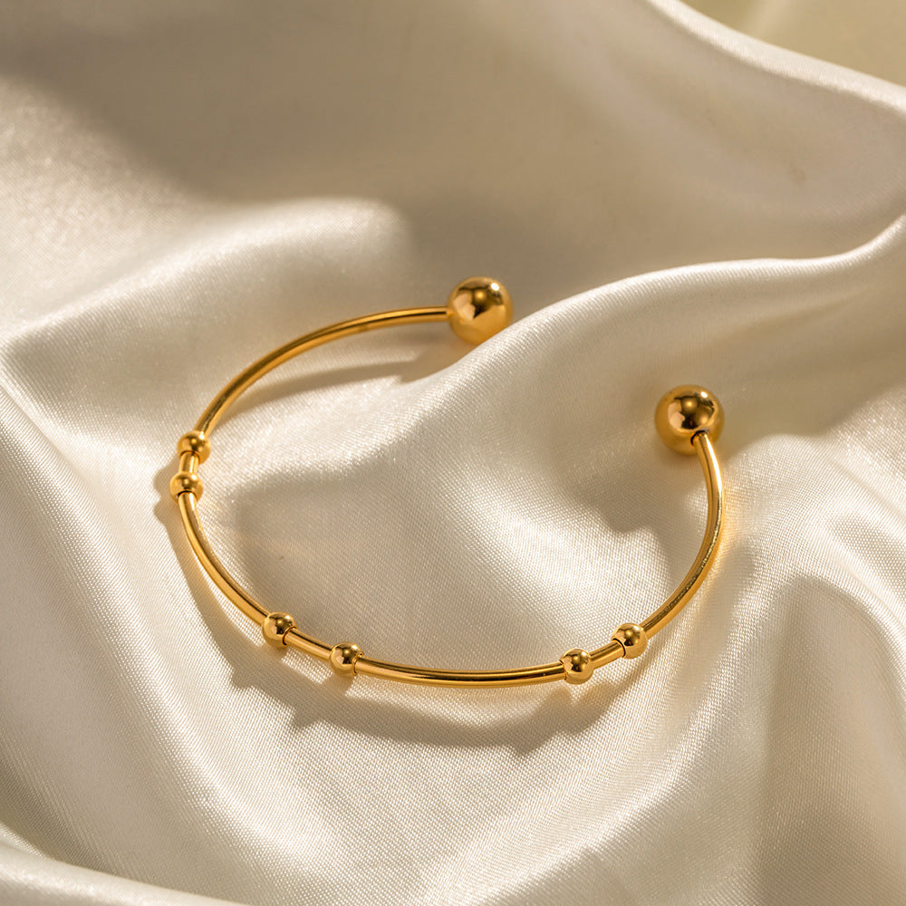 Valantomode | Plated Camille Bangle with Spherical Focal Assets and Monolithic Architecture
