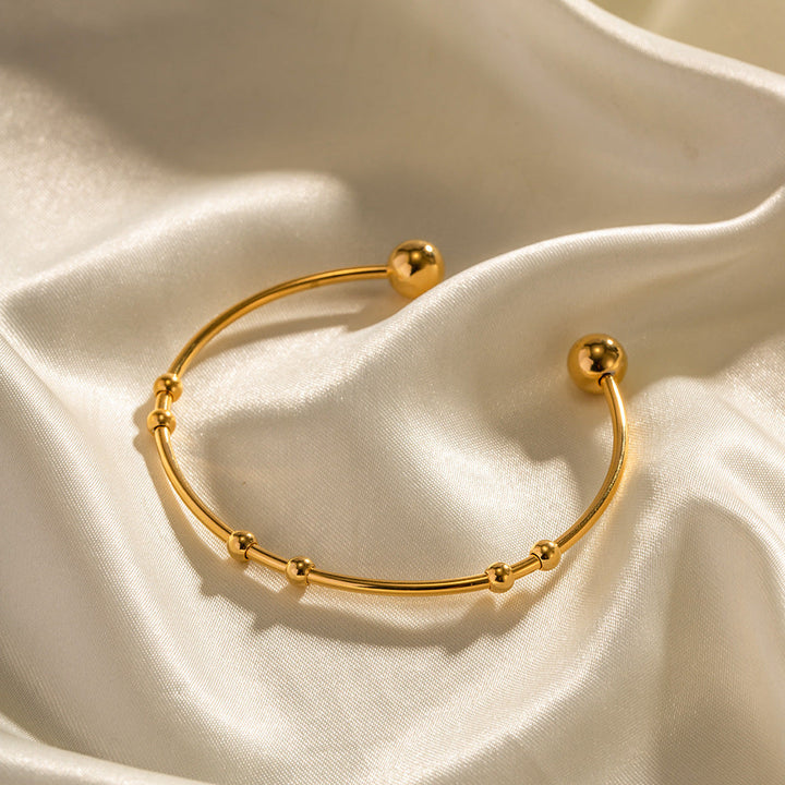 Valantomode | Plated Camille Bangle with Spherical Focal Assets and Monolithic Architecture