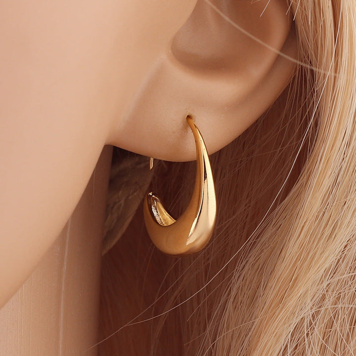 Valantomode | Plated Delilah Hoop Earrings with Crescent Volumetric Architecture and High-Mass Geometry