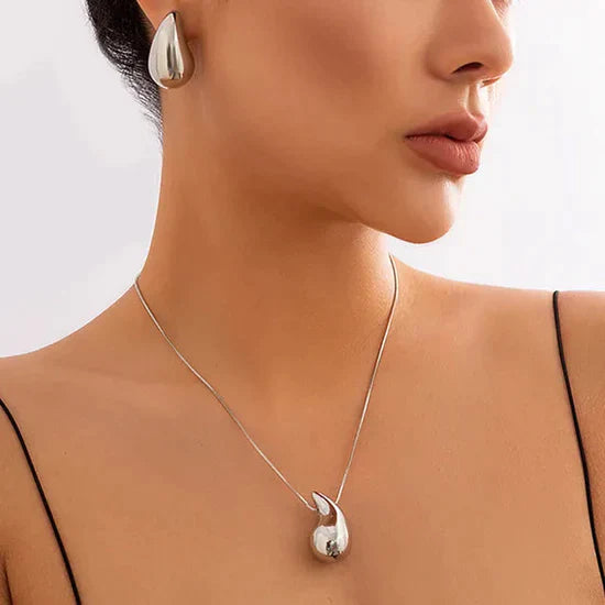 Valantomode | Plated Volumetric Teardrop Earrings with Monolithic Liquid Architecture